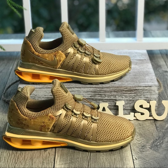 nike shox gravity women's gold